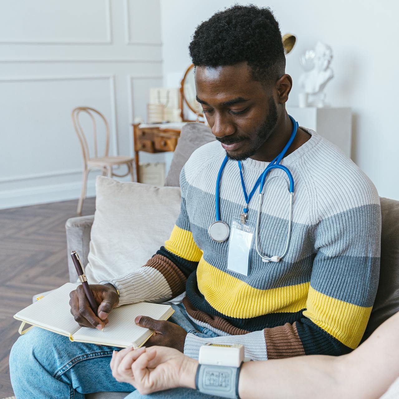 Medical nurse or doctor helping taking vitals of unknown person