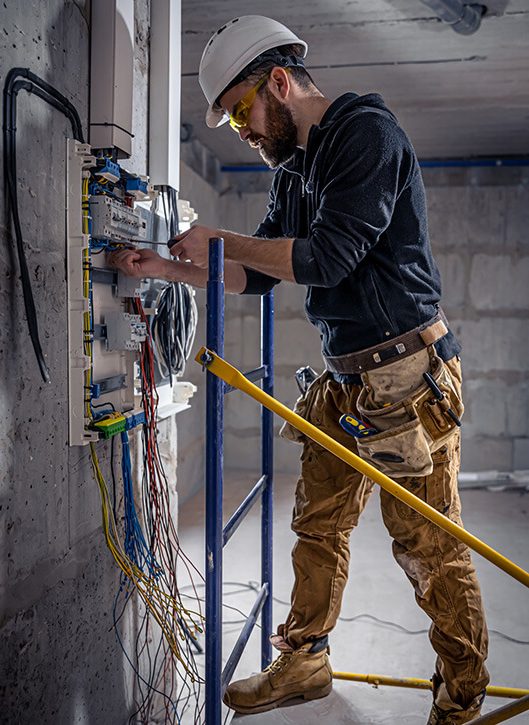 electrician assembling panel box breaker box