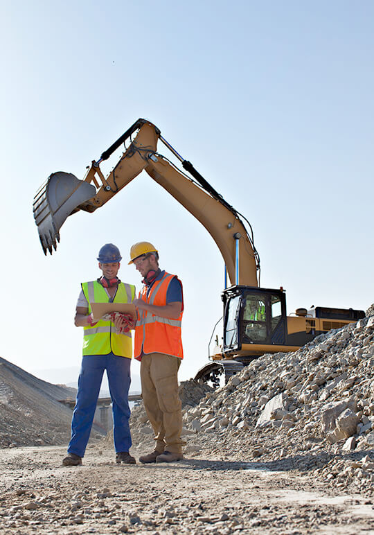 Constructors workers dig with backhoe