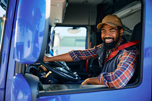 male truck driver inside vehicle