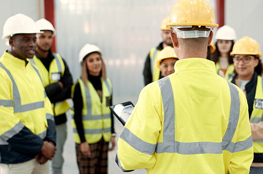 Construction manager holds team meeting